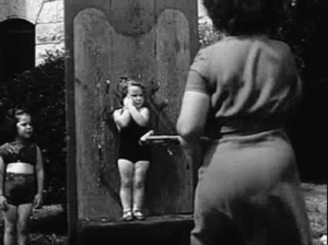 23 Knife-thrower Louella Gallagher throws knives at her daughter Colleena Sue, 2..png